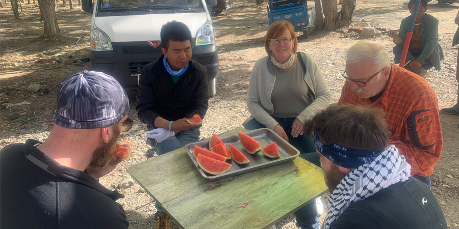 Enjoying watermelon during Tibetan picnic time 