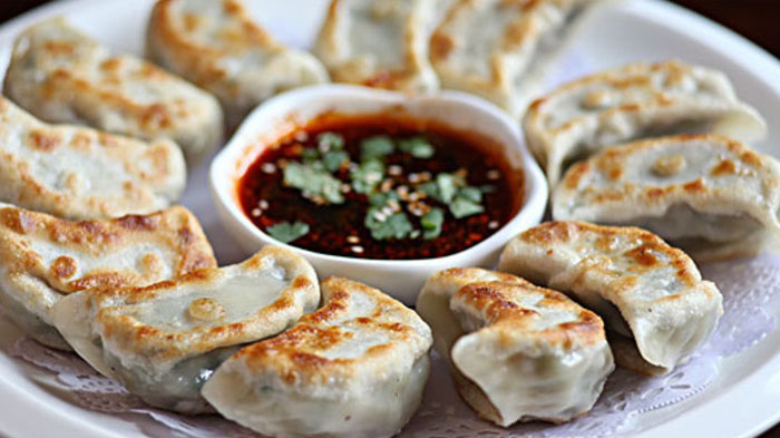Fried beef momos with dipping sauce