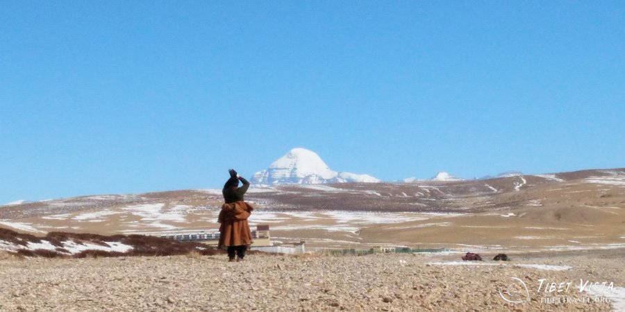 A pious Tibetan pilgrim worshipping the holy Mt.Kailash