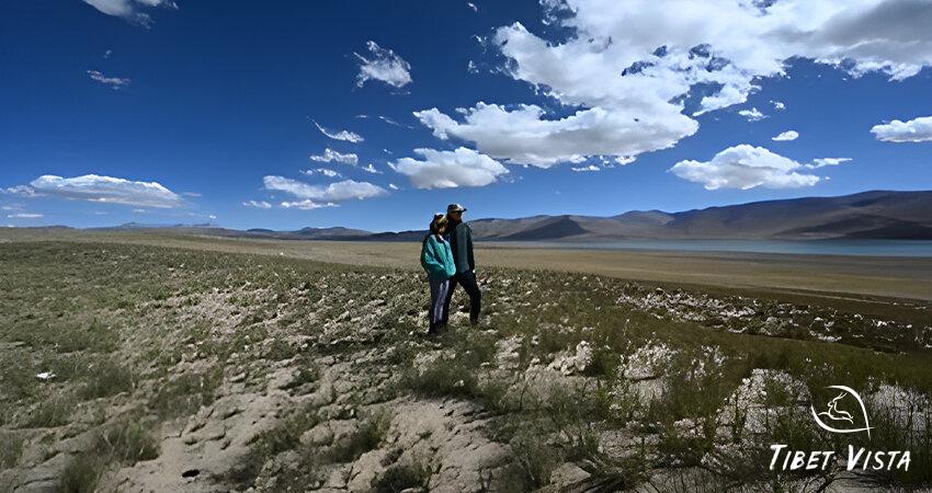 Tourists stroll around the Lake Manasarovar