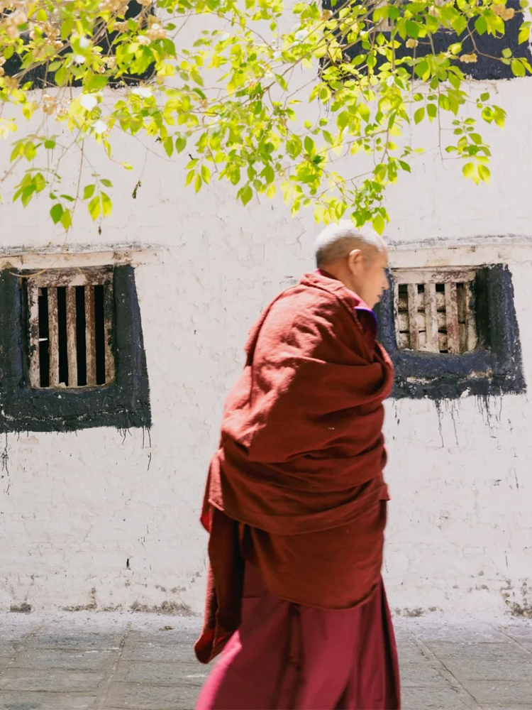 Tibetan monk in red robe at Sera Monastery in Lhasa