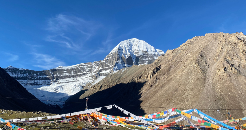 tibetan prayer flags in front of sacred mount kailash