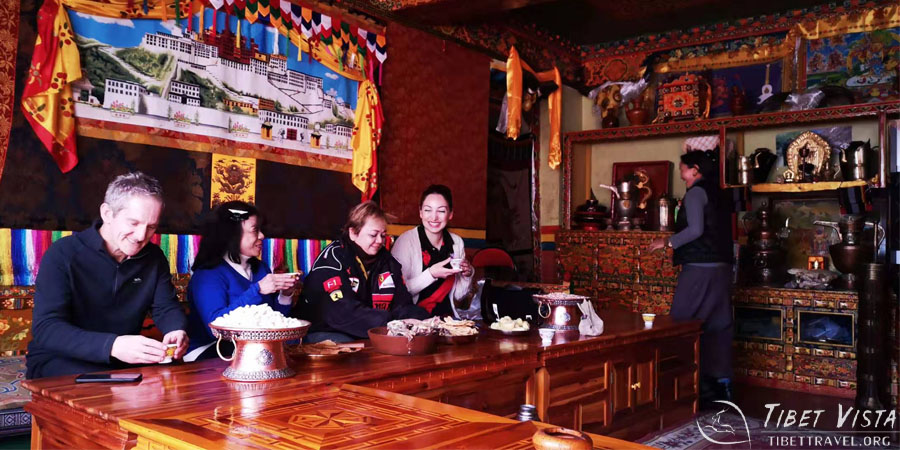 Enjoying home-made Tibetan food in a local family home