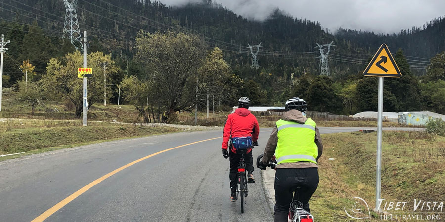 Cycling along the scenic roads through the mountains in Nyingchi