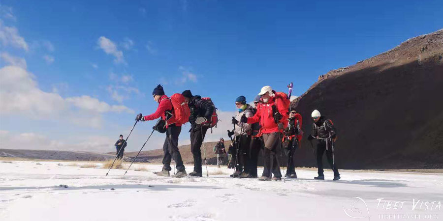 Hiking on the frozen icy ground of the kora around Mount Kailash