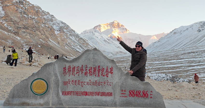 Traveler posing at Mt. Everest Monument at Tibet EBC in the morning