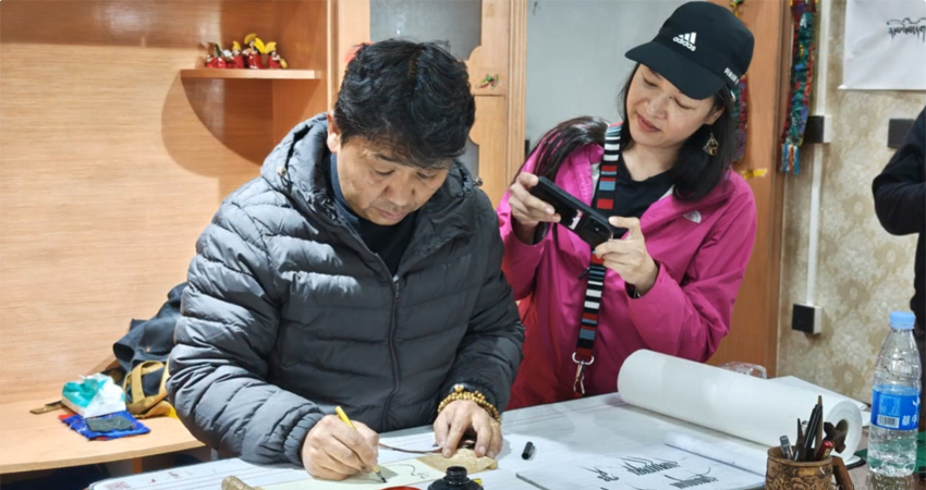 Hands-on session learning Tibetan calligraphy