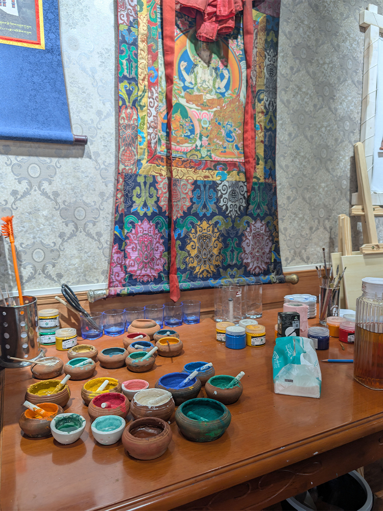 Traditional Tibetan Thangka painting with vibrant colors