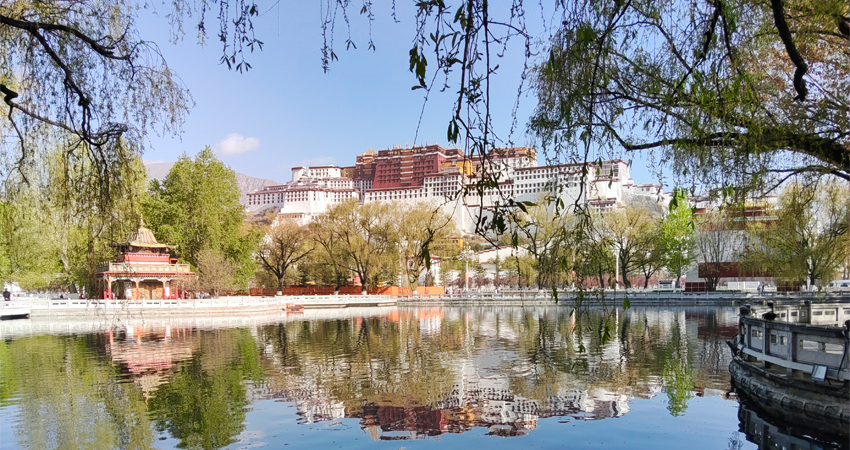 Potala Palace reflected in lake at Lhasa park