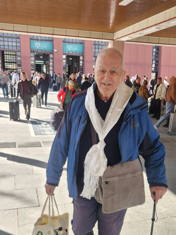 Traveler welcomed with khata at Lhasa Railway Station