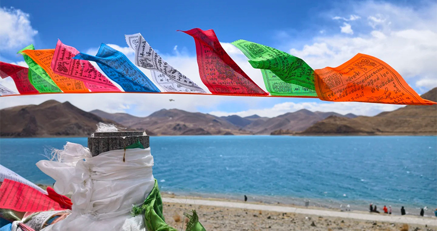 Yamdrok Lake with prayer flags between Lhasa and Shigatse
