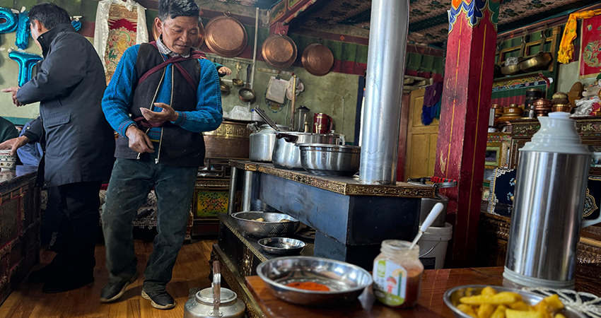 Having dinner with a local Tibetan family
