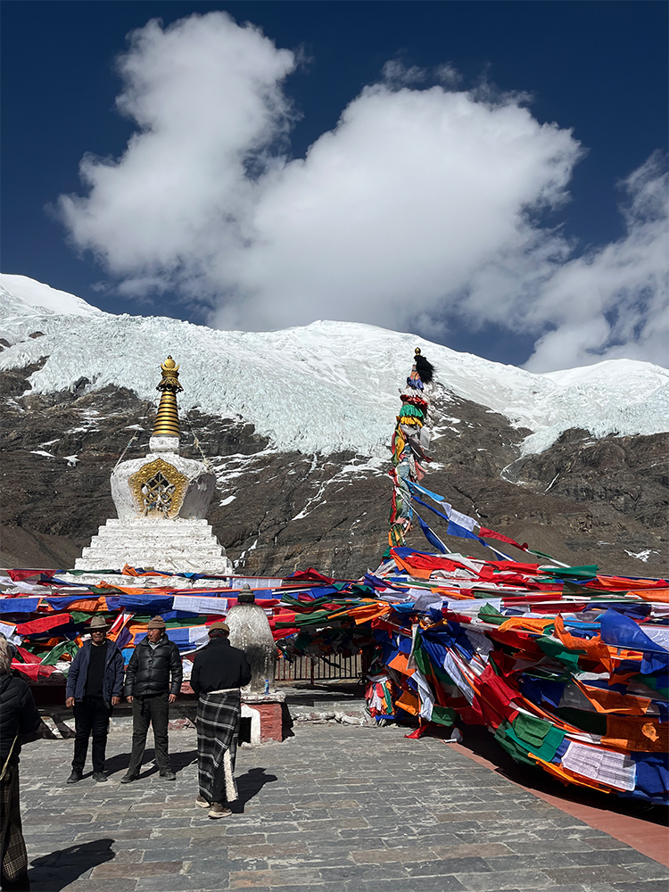 Karola Glacier Gyantse Tibet prayer flags stupa view