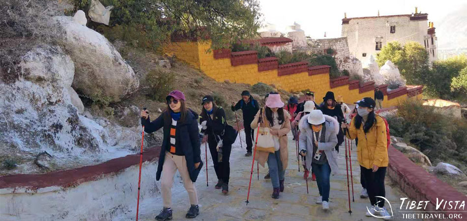 Stopping to pray with the monks at Ganden Monastery