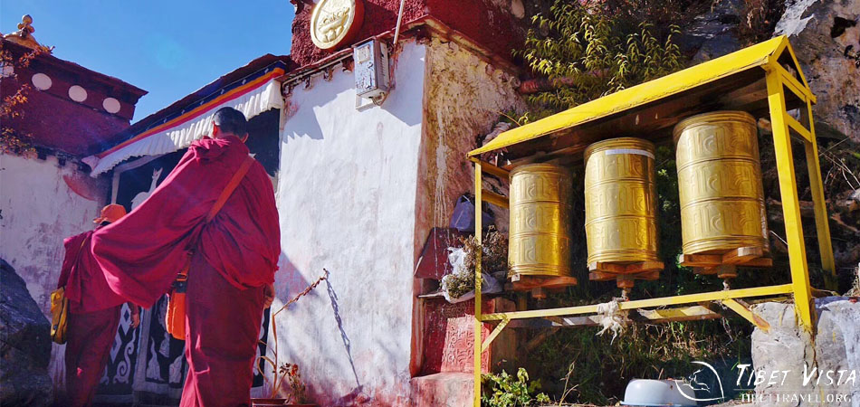 Stopping to pray with the monks at Ganden Monastery