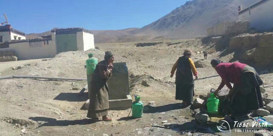 Tibetan ladies were carrying water supply