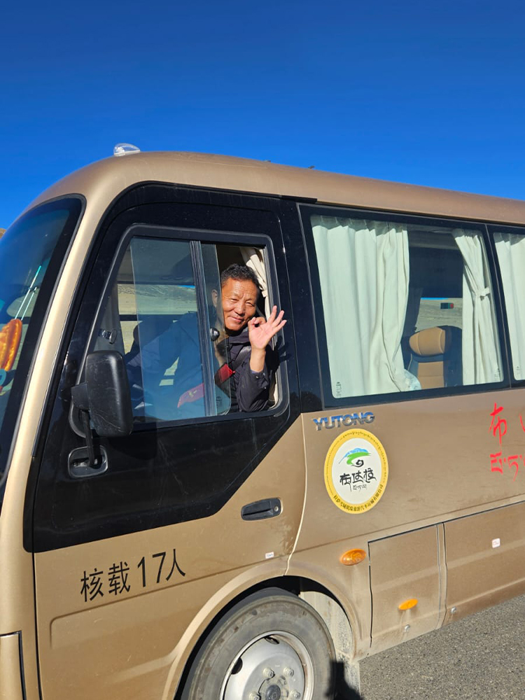 Tibetan driver with a warm smile