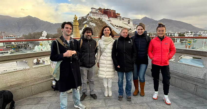 Group of travelers at Potala Palace viewpoint from Chakpori Hill Lhasa