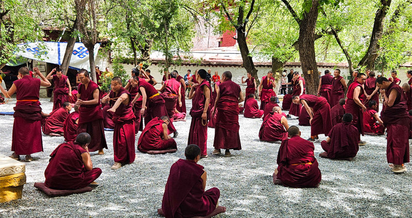 Monks debating at Sera Monastery courtyard in Lhasa