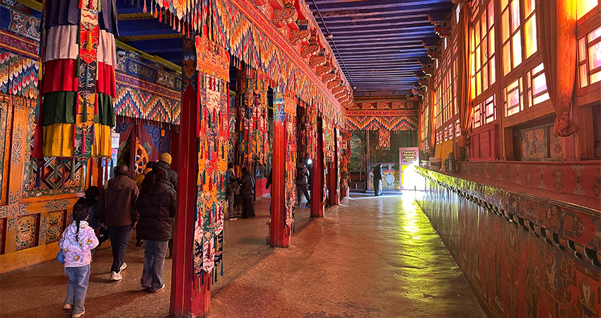 Intricate carvings and colorful paintings inside a Tibetan monastery