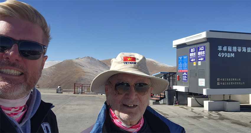 Tourists near oxygen chamber at high altitude in Tibet