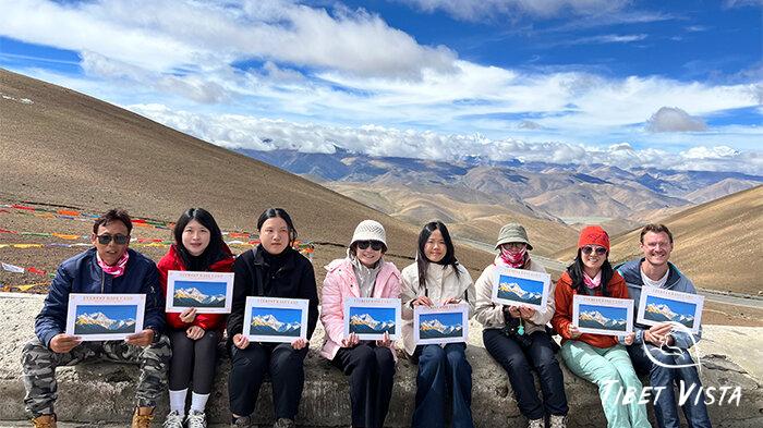 Group photo with Mount Everest, featuring our tourists and tour guide.