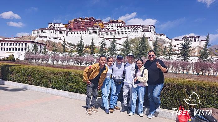 Family photo in front of the Potala Palace, the most iconic landmark in Tibet