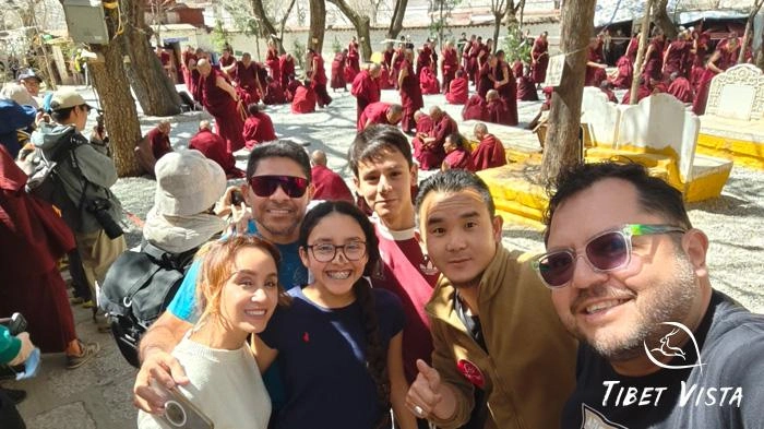 The kids are thrilled to watch the monk debate at Sera Monastery.