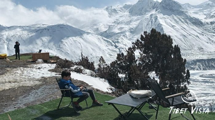 Lush greenery set against snow-capped peaks are a common sight in eastern Tibet.