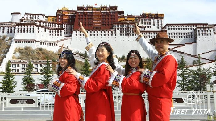 Photos in Tibetan traditional dress in front of Potala Palace.