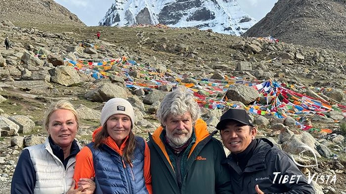A cherished photo of our beloved customer with Mt. Kailash and our Tibetan guide