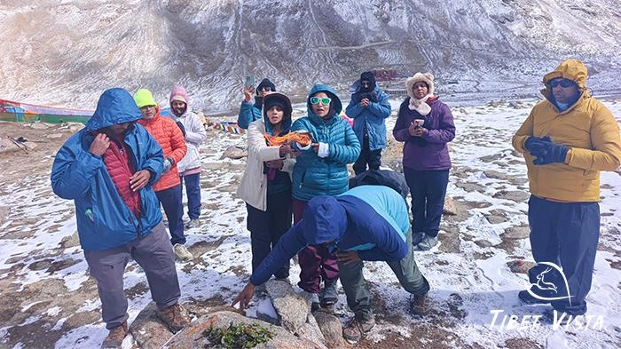A sacred moment of our dear customer doing rituals on the Kailash kora.