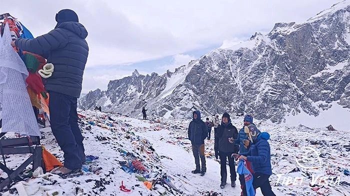 Guests from Croatia hanging prayer flags during the kora around Mt. Kailash.