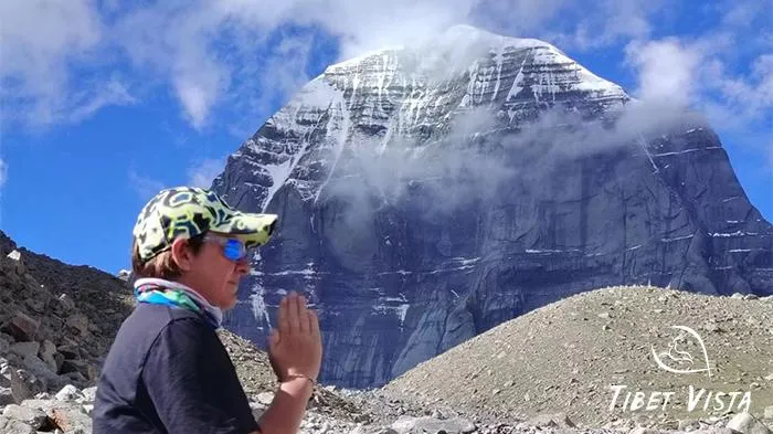 Guest prays in front of Mt.Kailash