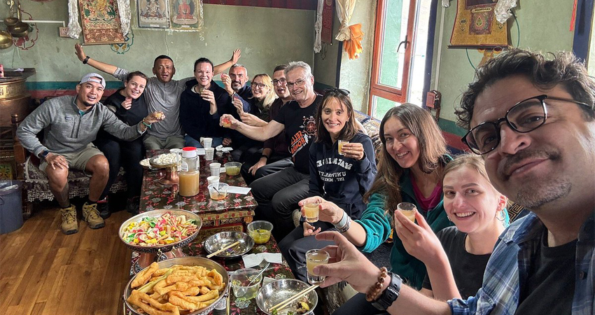 Travelers enjoying Tibetan lunch near Yamdrok Lake