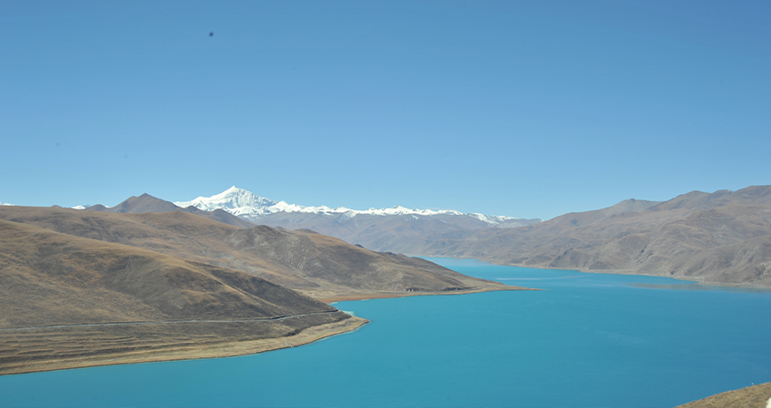 Yamdrok Lake surrounded by mountains and valleys