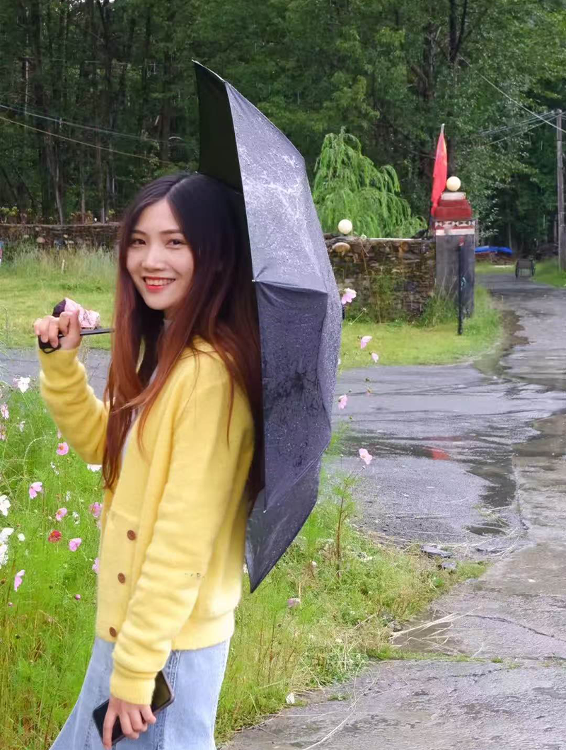 Sara is enjoying the lush greenery of Tibet.