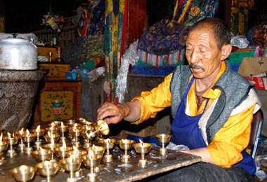 Cleaning jars for yak butter lamps in Samye